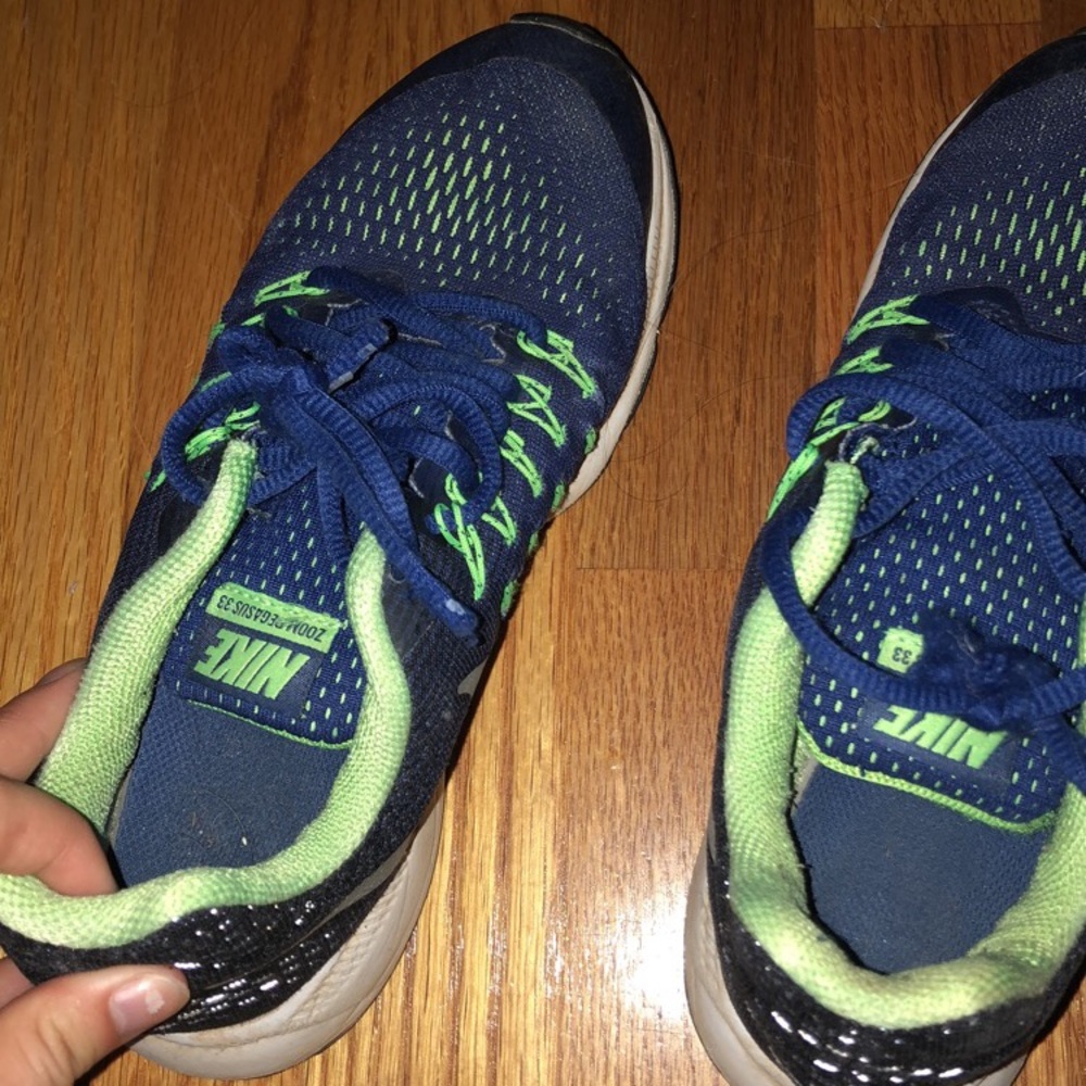 Blue and green Nike tennis shoes